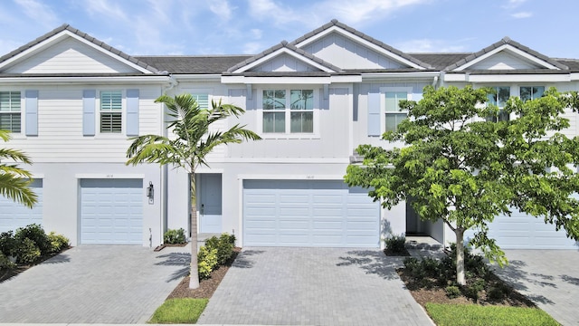 1416 Gopher Ter, Stuart, FL 34994 - multi unit property featuring a tile roof, a garage, and driveway