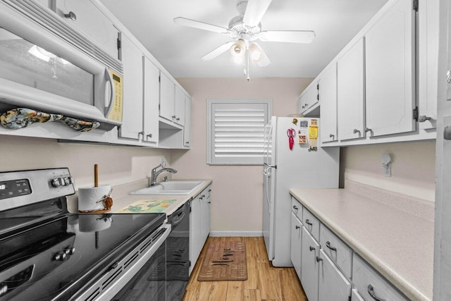 7376 W Oakridge Cir Unit C4320, Lake Worth, FL 33462 - kitchen with white appliances, light wood finished floors, white cabinets, a ceiling fan, and light countertops