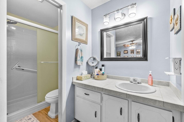 7376 W Oakridge Cir Unit C4320, Lake Worth, FL 33462 - bathroom featuring a shower stall, vanity, and wood finished floors