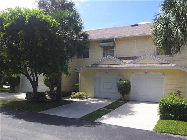 5051 Pointe Emerald Ln Unit 5051, Boca Raton, FL 33486 - view of front facade featuring driveway and an attached garage