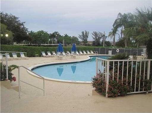 5051 Pointe Emerald Ln Unit 5051, Boca Raton, FL 33486 - community pool featuring a patio