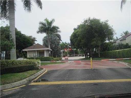 5051 Pointe Emerald Ln Unit 5051, Boca Raton, FL 33486 - view of asphalt road with curbs