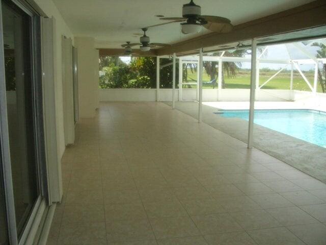 24 Dunbar Rd, Palm Beach Gardens, FL 33418 - swimming pool featuring a ceiling fan