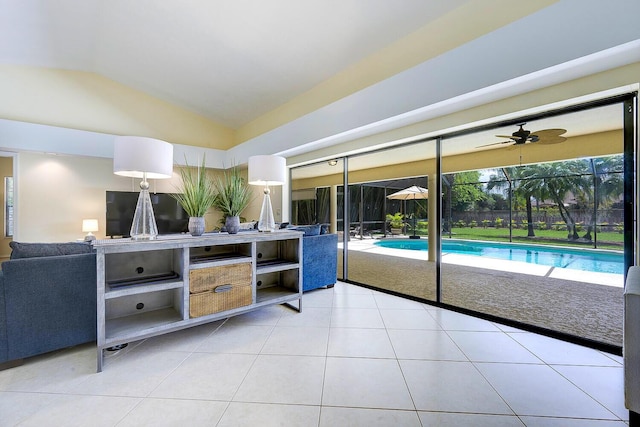2282 NE Marlberry Ln, Jensen Beach, FL 34957 - tiled living area with lofted ceiling and a ceiling fan