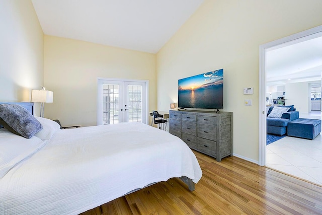 2282 NE Marlberry Ln, Jensen Beach, FL 34957 - bedroom with french doors, wood finished floors, and access to exterior