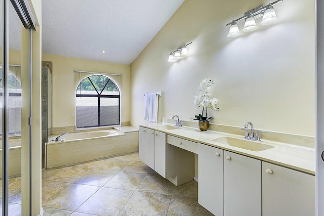 2282 NE Marlberry Ln, Jensen Beach, FL 34957 - bathroom with a bath, double vanity, and tile patterned floors