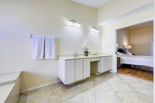 2282 NE Marlberry Ln, Jensen Beach, FL 34957 - bathroom featuring ensuite bath and double vanity