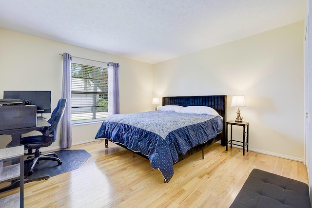 2282 NE Marlberry Ln, Jensen Beach, FL 34957 - bedroom featuring light wood-type flooring and a desk