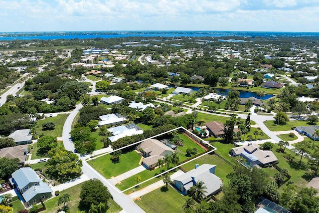 2282 NE Marlberry Ln, Jensen Beach, FL 34957 - aerial perspective of suburban area with property boundaries highlighted and a nearby body of water