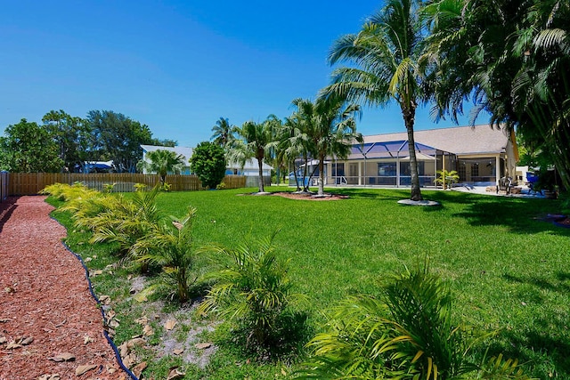 2282 NE Marlberry Ln, Jensen Beach, FL 34957 - view of yard featuring glass enclosure