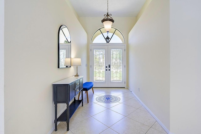 2282 NE Marlberry Ln, Jensen Beach, FL 34957 - foyer featuring french doors and light tile patterned floors