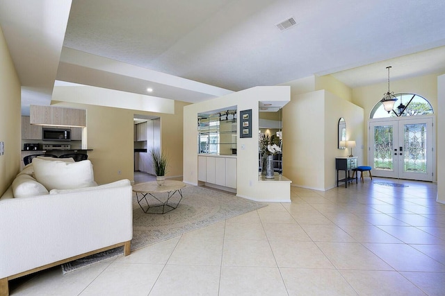 2282 NE Marlberry Ln, Jensen Beach, FL 34957 - living area featuring french doors and light tile patterned floors