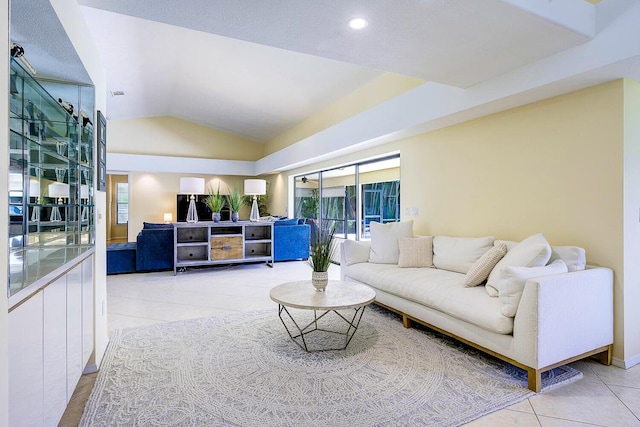 2282 NE Marlberry Ln, Jensen Beach, FL 34957 - living area featuring healthy amount of natural light, lofted ceiling, and light tile patterned floors