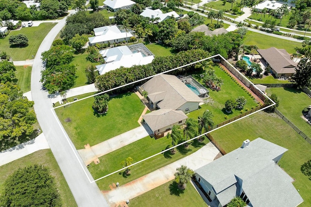2282 NE Marlberry Ln, Jensen Beach, FL 34957 - aerial perspective of suburban area featuring property parcel outlined