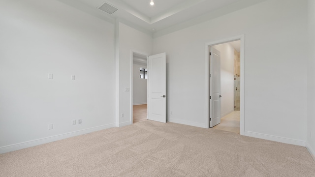 203 SE Via Sangro, Port Saint Lucie, FL 34952 - unfurnished bedroom with light colored carpet and ensuite bath