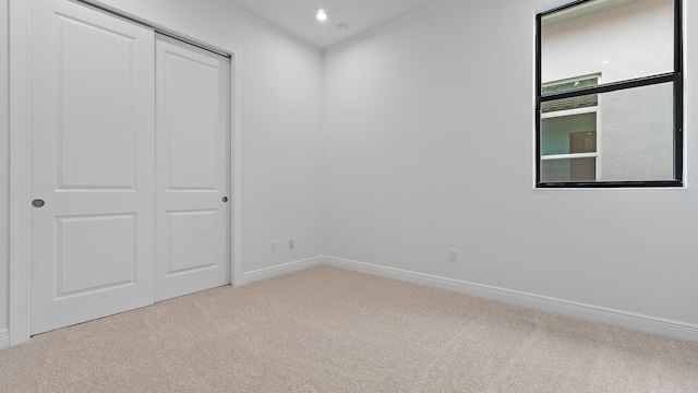 203 SE Via Sangro, Port Saint Lucie, FL 34952 - unfurnished bedroom featuring carpet floors and a closet