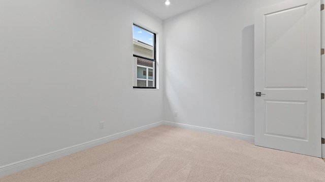 203 SE Via Sangro, Port Saint Lucie, FL 34952 - carpeted empty room with baseboards and recessed lighting
