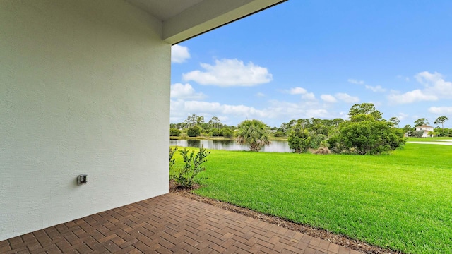 203 SE Via Sangro, Port Saint Lucie, FL 34952 - view of grassy yard with a water view
