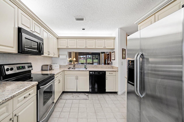 767 Windermere Way Unit 767, Palm Beach Gardens, FL 33418 - kitchen with black appliances, light tile patterned flooring, a textured ceiling, and tasteful backsplash