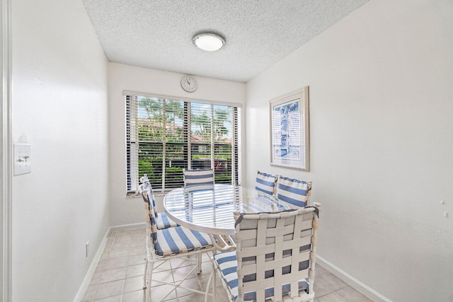 767 Windermere Way Unit 767, Palm Beach Gardens, FL 33418 - dining area featuring light tile patterned flooring and a textured ceiling