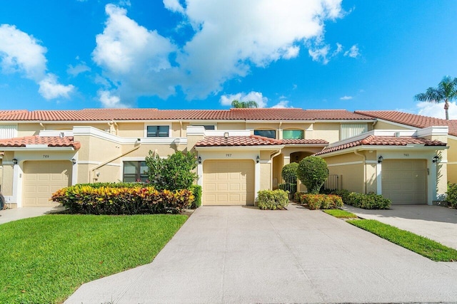 767 Windermere Way Unit 767, Palm Beach Gardens, FL 33418 - view of front facade with a front yard, stucco siding, a tile roof, and a garage