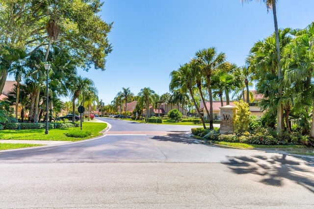 767 Windermere Way Unit 767, Palm Beach Gardens, FL 33418 - view of asphalt street with street lighting, traffic signs, and a residential view