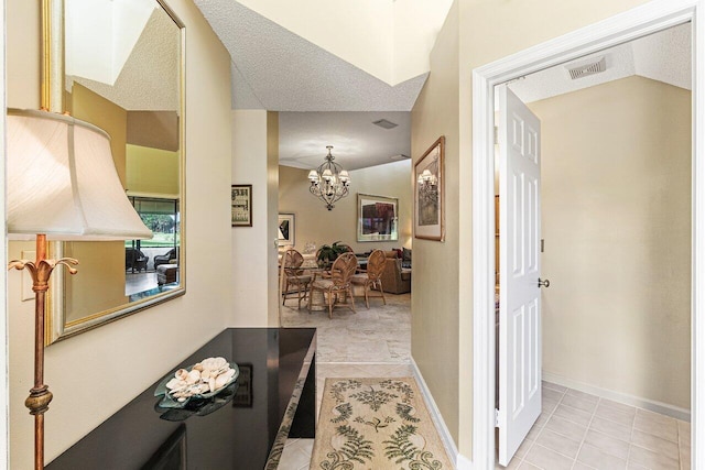 767 Windermere Way Unit 767, Palm Beach Gardens, FL 33418 - hallway featuring light tile patterned floors and a chandelier