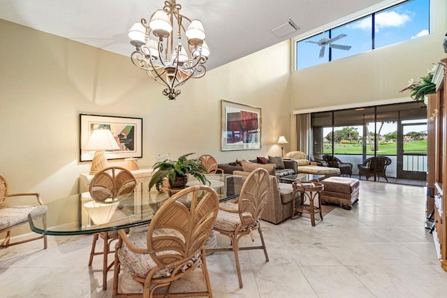 767 Windermere Way Unit 767, Palm Beach Gardens, FL 33418 - dining room featuring a chandelier and a towering ceiling