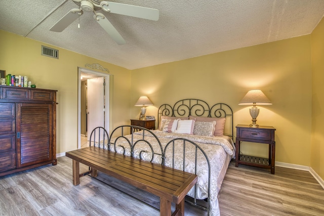11186 Green Lake Dr Unit 202, Boynton Beach, FL 33437 - bedroom with wood finished floors, a textured ceiling, and ceiling fan