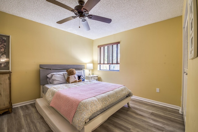 11186 Green Lake Dr Unit 202, Boynton Beach, FL 33437 - bedroom with dark wood-type flooring, a textured ceiling, and a ceiling fan