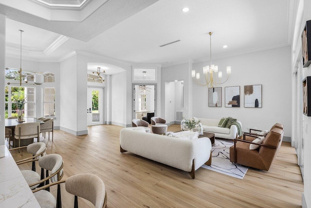 11533 Manatee Ter Unit 11533, Lake Worth, FL 33449 - living room with a chandelier, crown molding, light wood finished floors, recessed lighting, and arched walkways