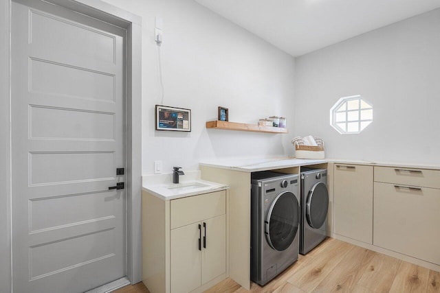 11533 Manatee Ter Unit 11533, Lake Worth, FL 33449 - laundry area with washing machine and clothes dryer, light wood finished floors, and cabinet space