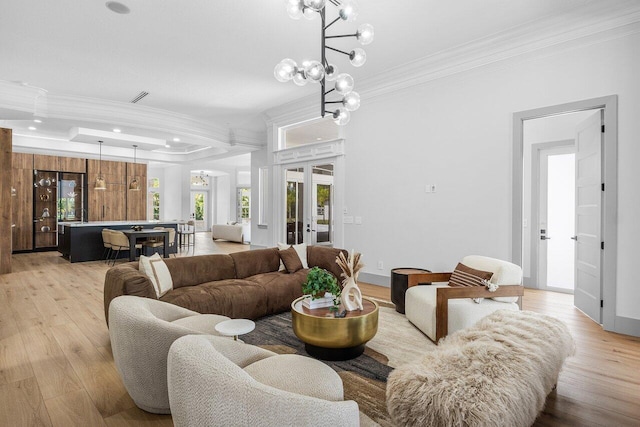 11533 Manatee Ter Unit 11533, Lake Worth, FL 33449 - living area with crown molding, french doors, a chandelier, light wood finished floors, and recessed lighting