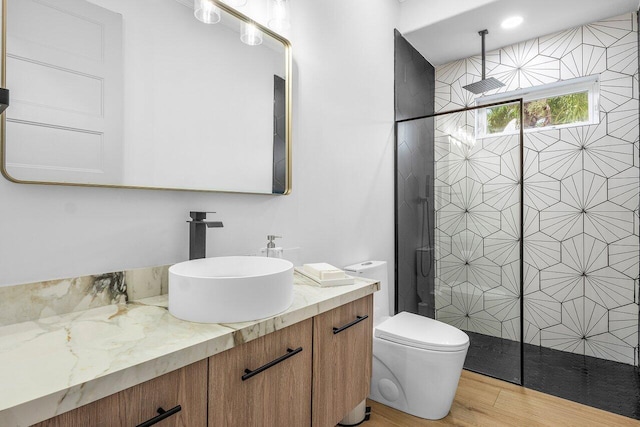 11533 Manatee Ter Unit 11533, Lake Worth, FL 33449 - full bathroom featuring vanity, tiled shower, and wood finished floors