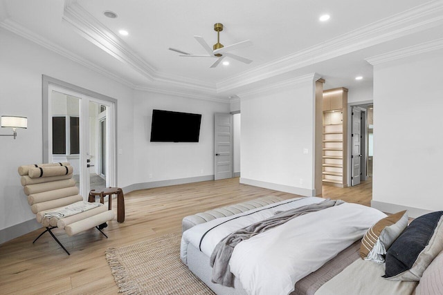11533 Manatee Ter Unit 11533, Lake Worth, FL 33449 - bedroom with ornamental molding, light wood-style floors, recessed lighting, a tray ceiling, and french doors