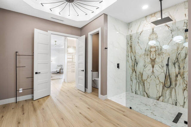 11533 Manatee Ter Unit 11533, Lake Worth, FL 33449 - full bathroom with wood finished floors, a marble finish shower, and a chandelier
