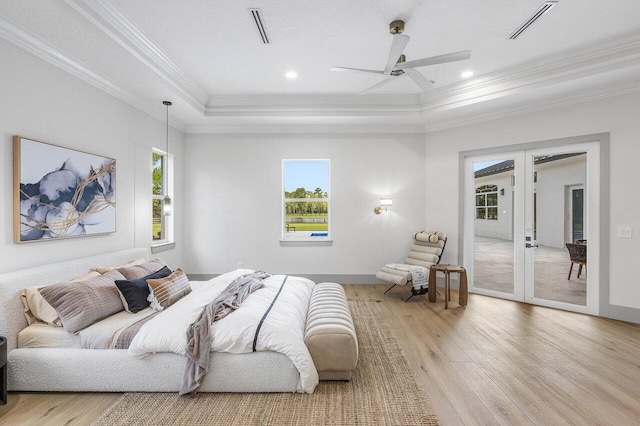 11533 Manatee Ter Unit 11533, Lake Worth, FL 33449 - bedroom featuring french doors, crown molding, light wood-style floors, a tray ceiling, and ceiling fan