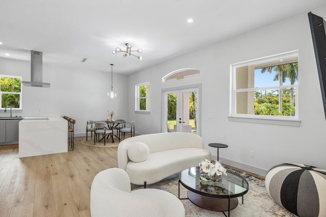 11533 Manatee Ter Unit 11533, Lake Worth, FL 33449 - living room with french doors, light wood-style floors, and recessed lighting