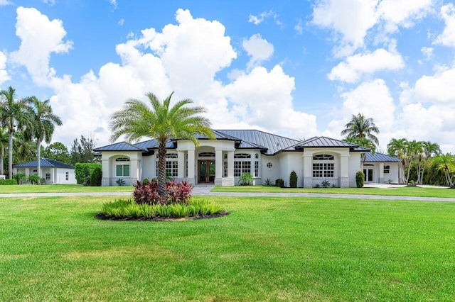 11533 Manatee Ter Unit 11533, Lake Worth, FL 33449 - view of front of home featuring a standing seam roof, french doors, a metal roof, and a front yard
