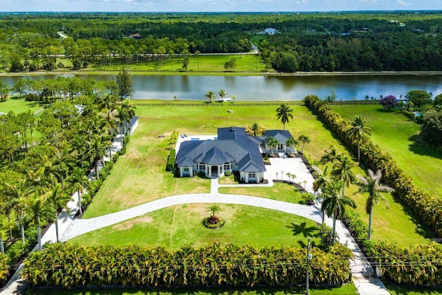 11533 Manatee Ter Unit 11533, Lake Worth, FL 33449 - aerial view of sparsely populated area with a nearby body of water and a forest