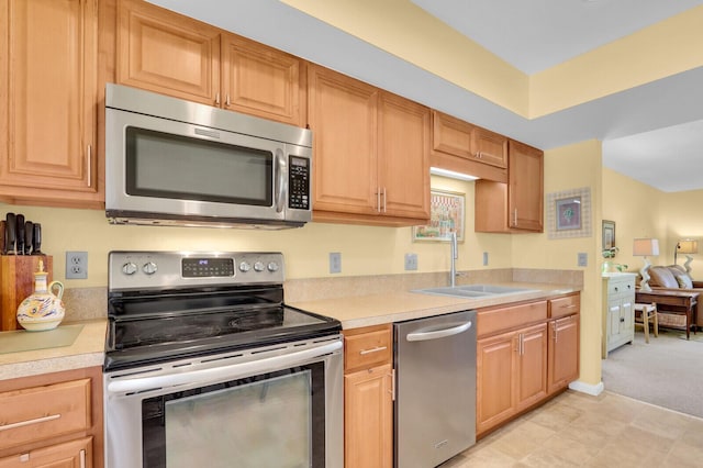 18429 SE Wood Haven Ln Unit G, Jupiter, FL 33469 - kitchen featuring appliances with stainless steel finishes and light countertops
