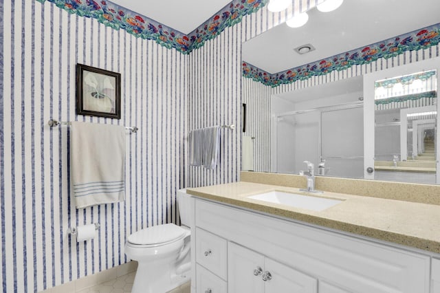 18429 SE Wood Haven Ln Unit G, Jupiter, FL 33469 - full bath with wallpapered walls, vanity, an enclosed shower, and tile patterned flooring