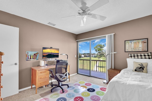 18429 SE Wood Haven Ln Unit G, Jupiter, FL 33469 - bedroom with light carpet, access to outside, a textured ceiling, and a ceiling fan