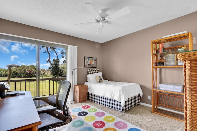 18429 SE Wood Haven Ln Unit G, Jupiter, FL 33469 - carpeted bedroom featuring access to exterior, a textured ceiling, and ceiling fan