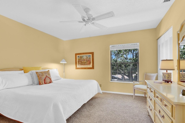 18429 SE Wood Haven Ln Unit G, Jupiter, FL 33469 - bedroom with light carpet and a ceiling fan