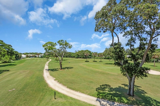 18429 SE Wood Haven Ln Unit G, Jupiter, FL 33469 - view of community featuring golf course view, a yard, and view of wooded area