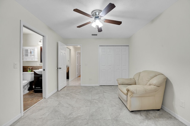 790 SE Ablett Ln, Port Saint Lucie, FL 34984 - living area featuring a ceiling fan and baseboards