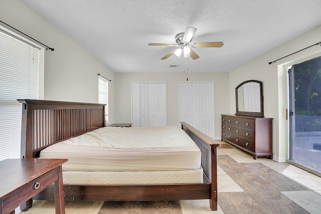 790 SE Ablett Ln, Port Saint Lucie, FL 34984 - bedroom featuring two closets, access to outside, and ceiling fan