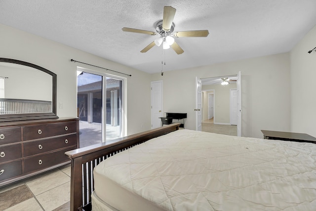 790 SE Ablett Ln, Port Saint Lucie, FL 34984 - bedroom featuring access to outside, ceiling fan, light tile patterned flooring, and a textured ceiling