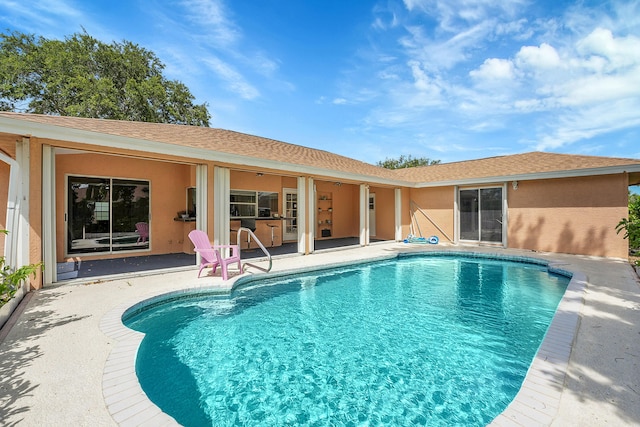 790 SE Ablett Ln, Port Saint Lucie, FL 34984 - swimming pool with a patio area